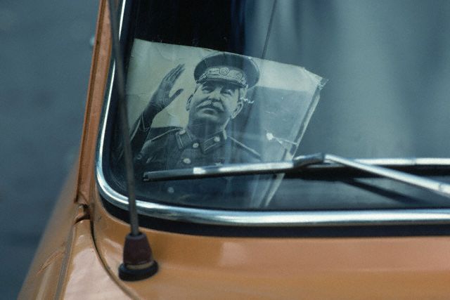 October 1981, Tbilisi, USSR --- Stalin Portrait in Taxi Window --- Image by © Marc Garanger/CORBIS